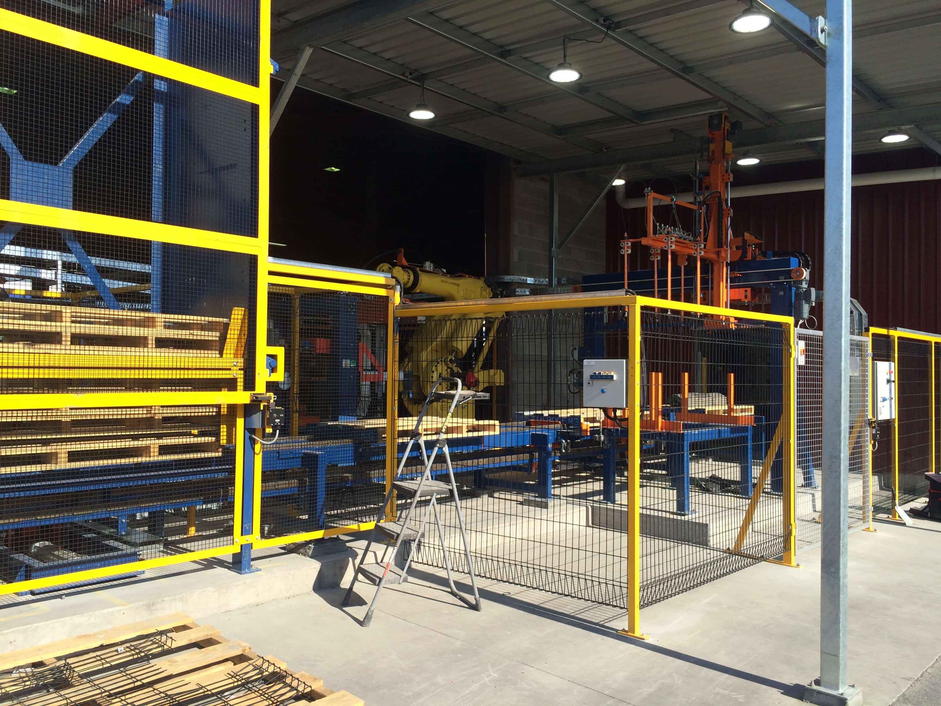 Industrial commissioning work taking place on automated process equipment