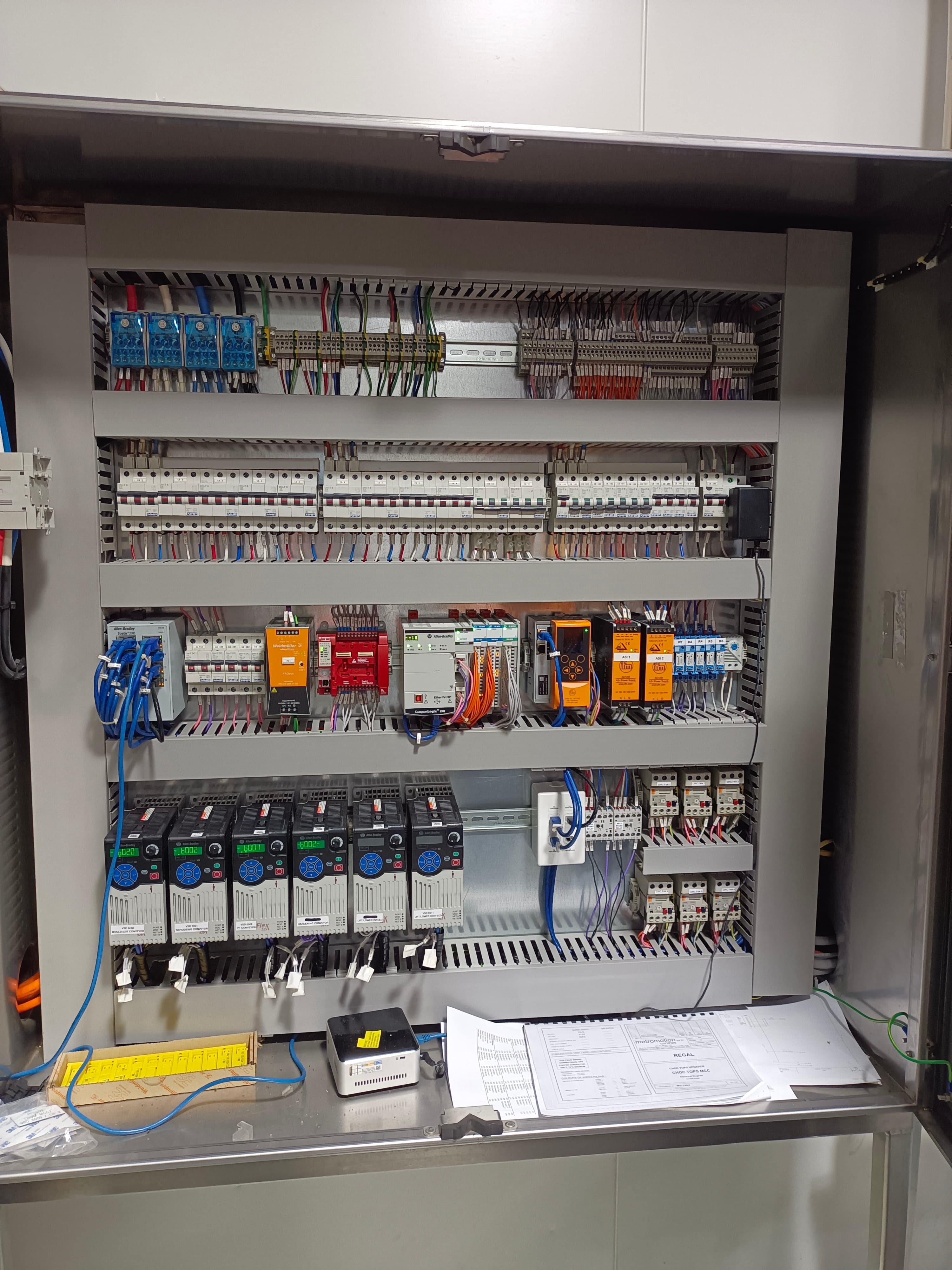 Open control panel with an Allen-Bradley CompactLogix PLC, I/O and variable speed drives