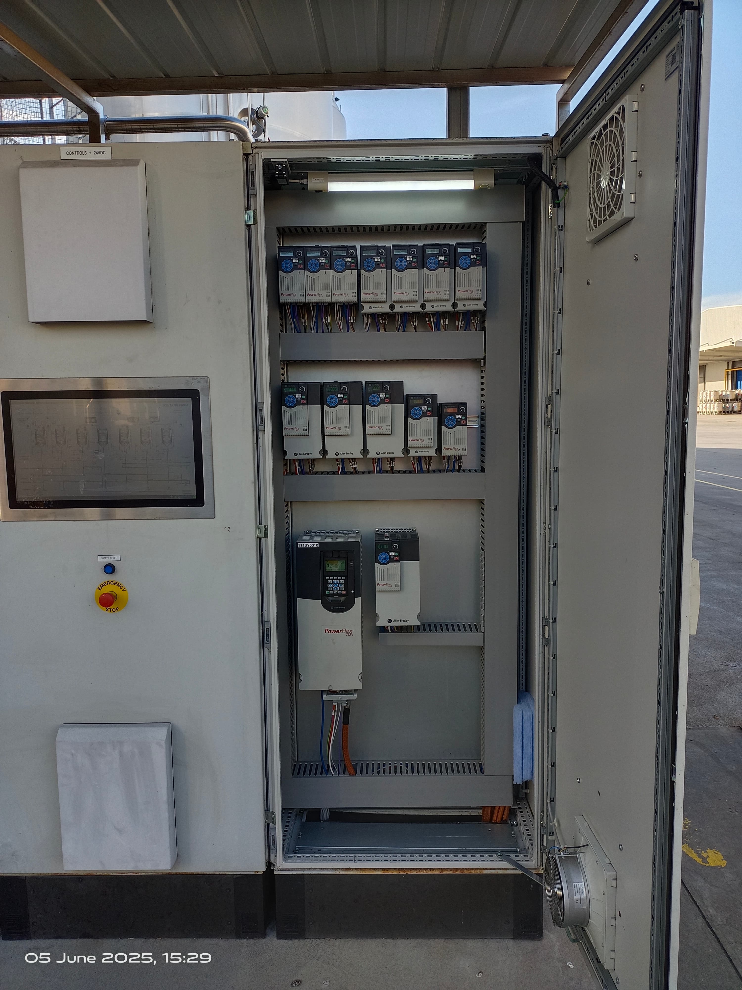 Control panel with an operator touchscreen and drives on a production line
