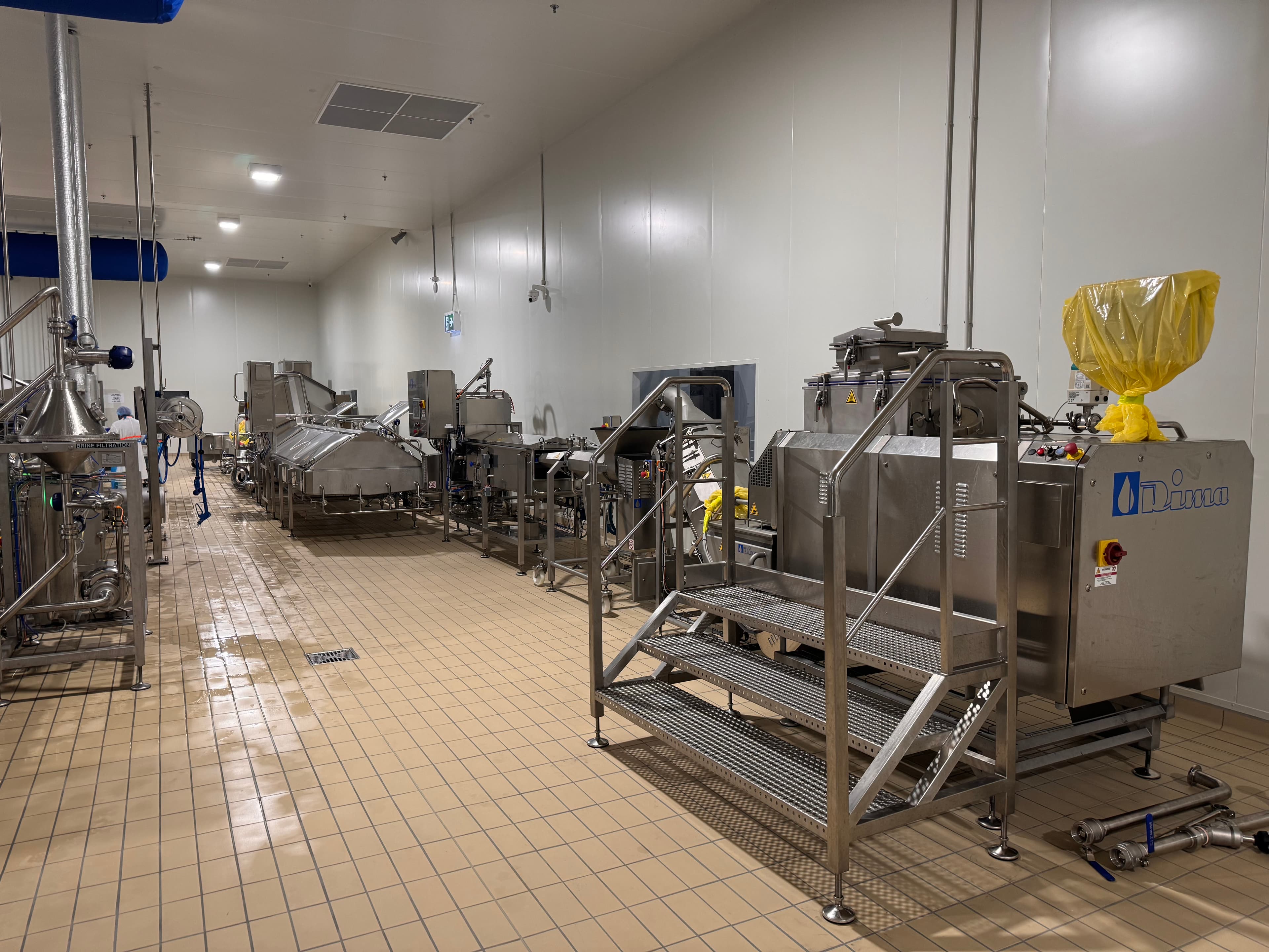 Stainless steel food processing equipment in a production hall